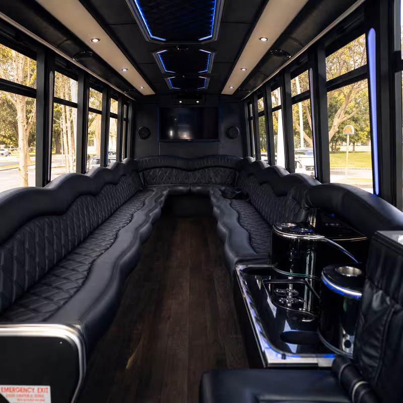 Friends laughing during a Minneapolis party bus celebration