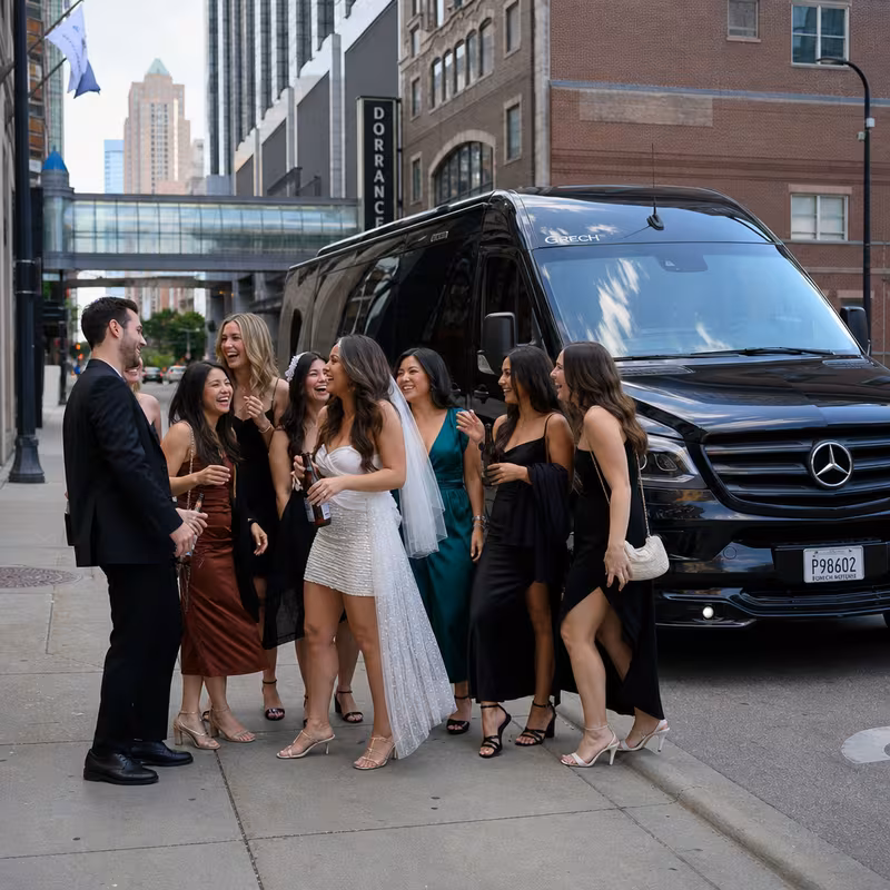 Group boarding a white charter bus for Bachelor & Bachelorette Transportation transportation in Minneapolis