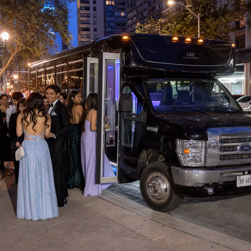 Passengers loading luggage while boarding an Minneapolis group shuttle