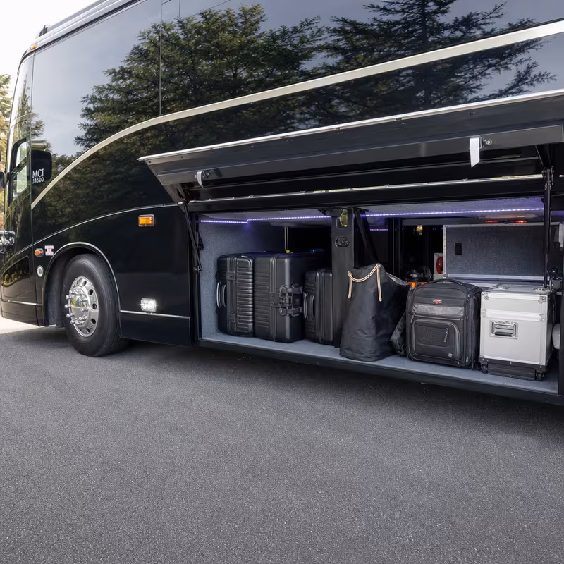 Party bus interior with wraparound leather seating and LED lighting in Minneapolis
