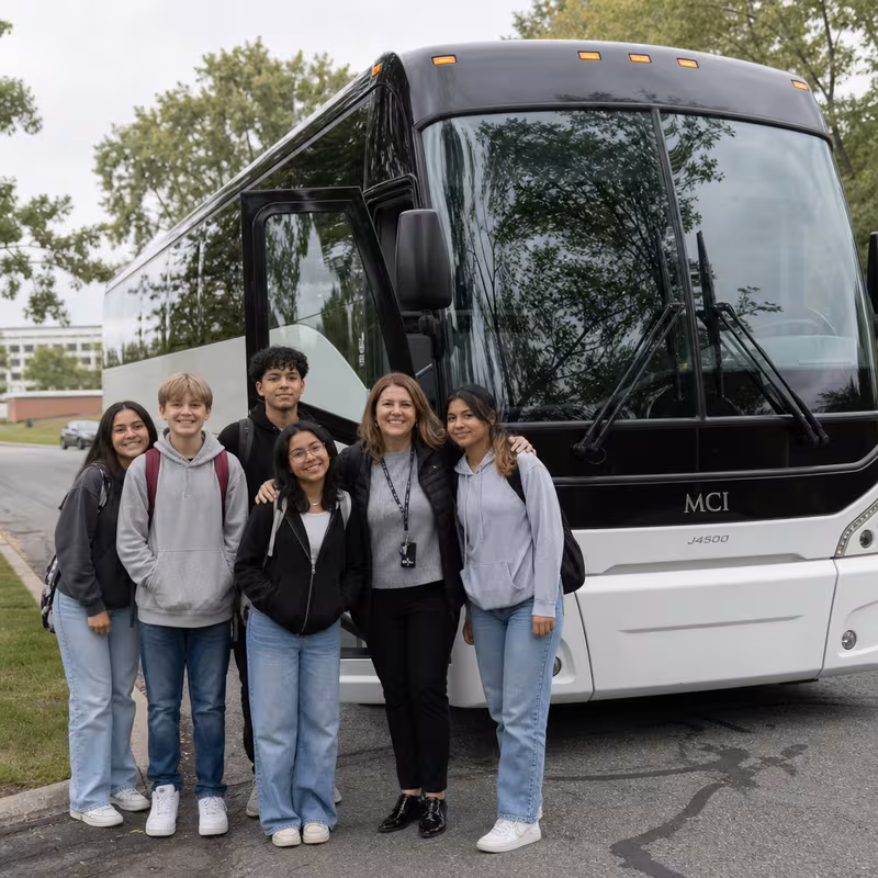 Passengers loading luggage while boarding an Minneapolis group shuttle