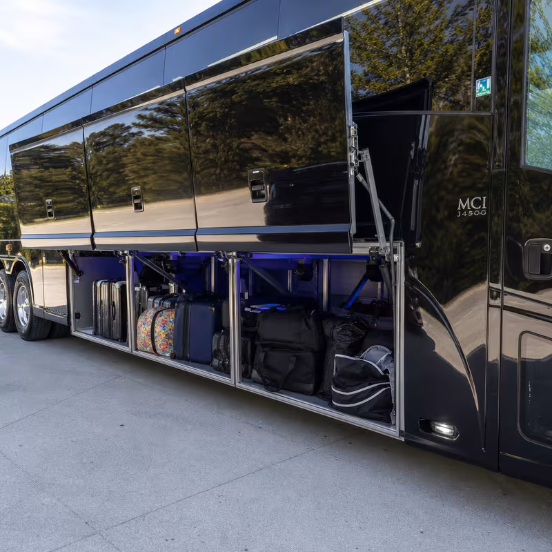 Party bus interior with wraparound leather seating and LED lighting in Minneapolis