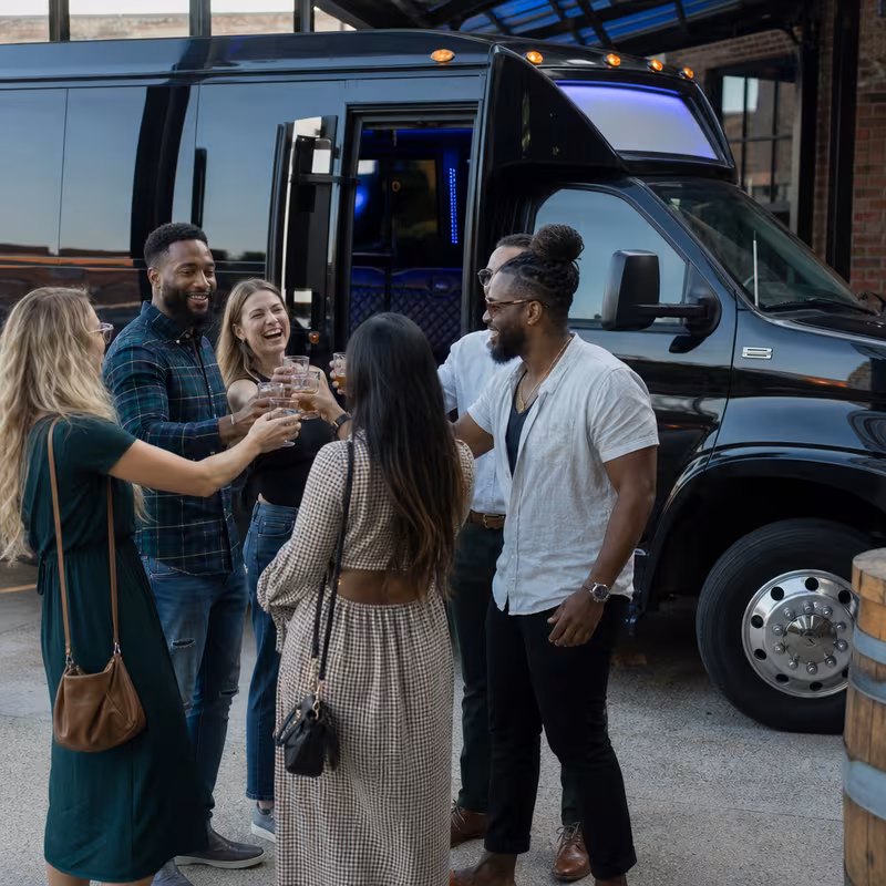 Passengers loading luggage while boarding an Minneapolis group shuttle